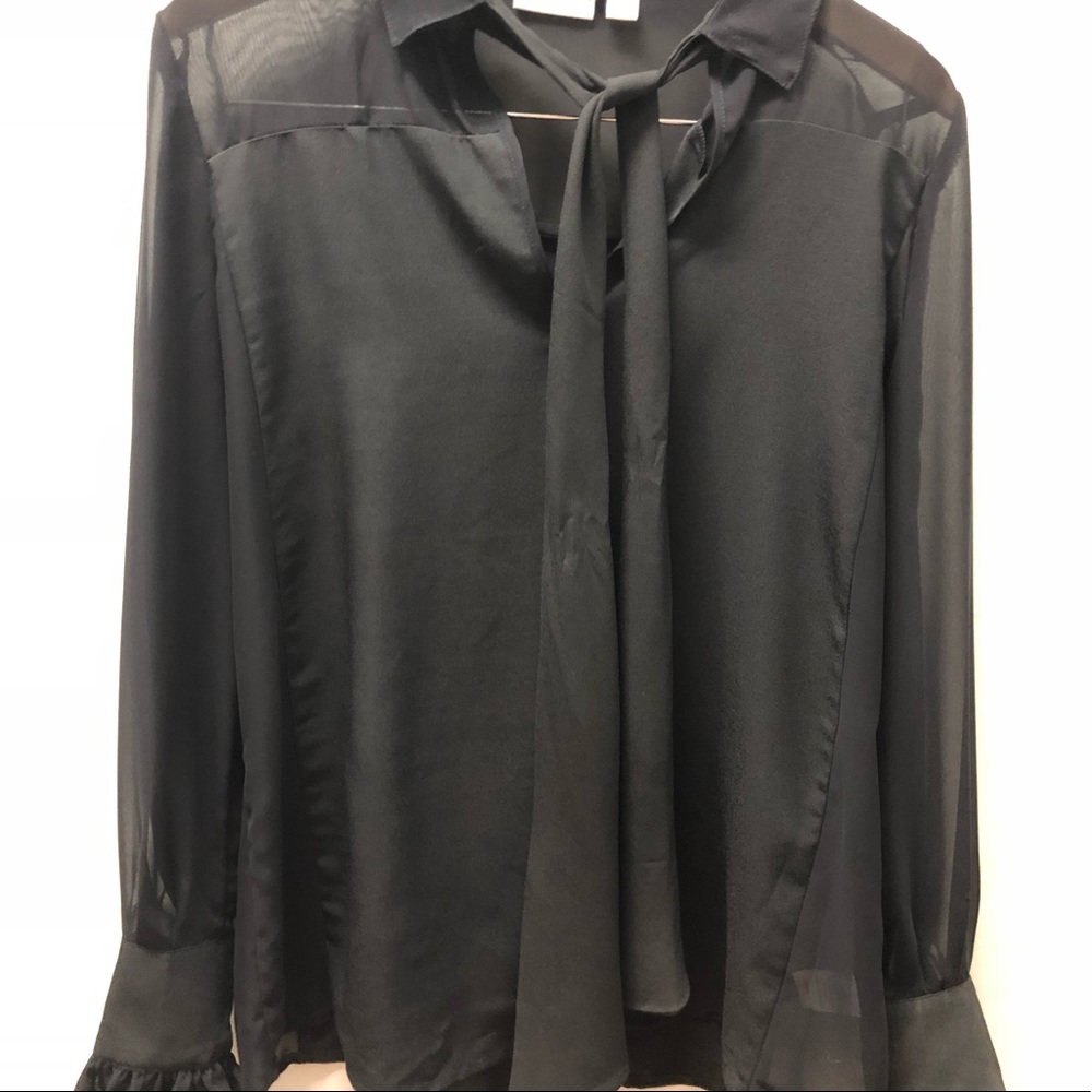 Black top with ruffle sleeves
